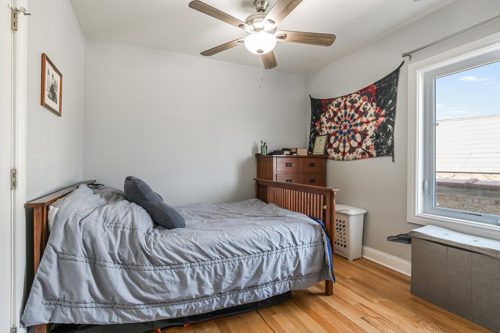 5481 North Northwest Highway Chicago, IL 60630 - Photo 25 of 60 a bedroom with a bed and wooden floor
