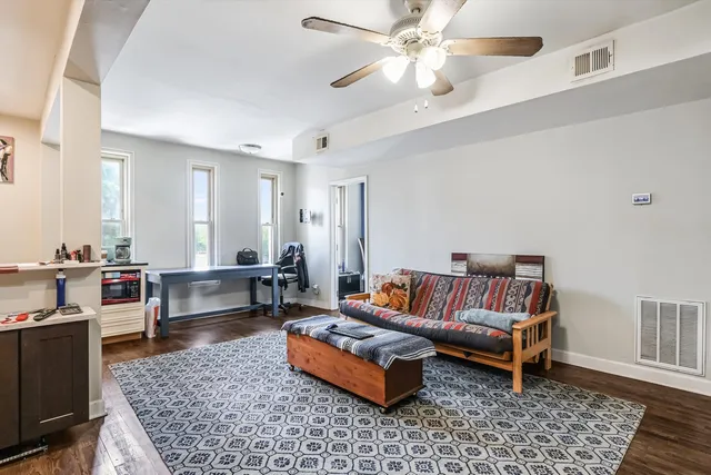 a bathroom with a toilet and a shower curtain