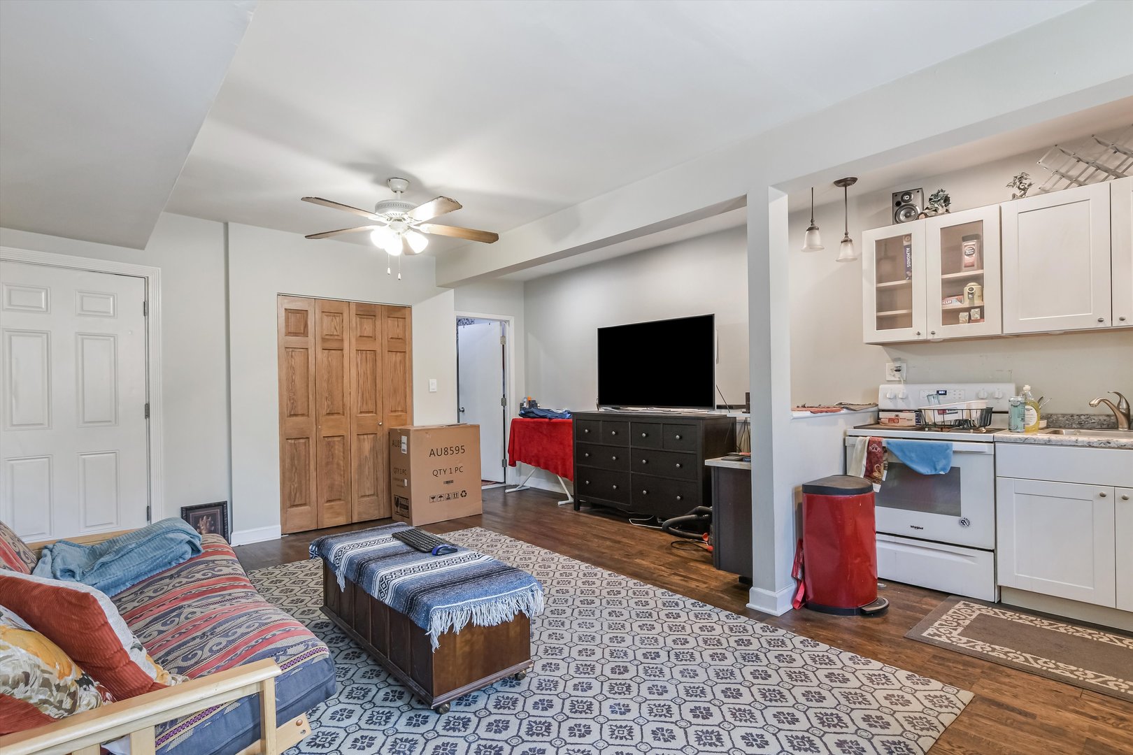 5481 North Northwest Highway Chicago, IL 60630 - Photo 30 of 60 a living room with furniture and a flat screen tv