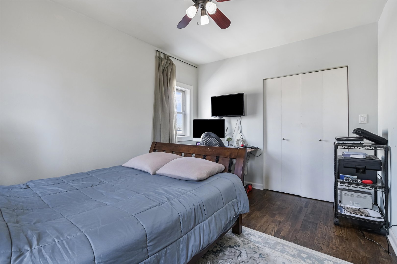 5481 North Northwest Highway Chicago, IL 60630 - Photo 31 of 60 a bedroom with a bed and a flat screen tv