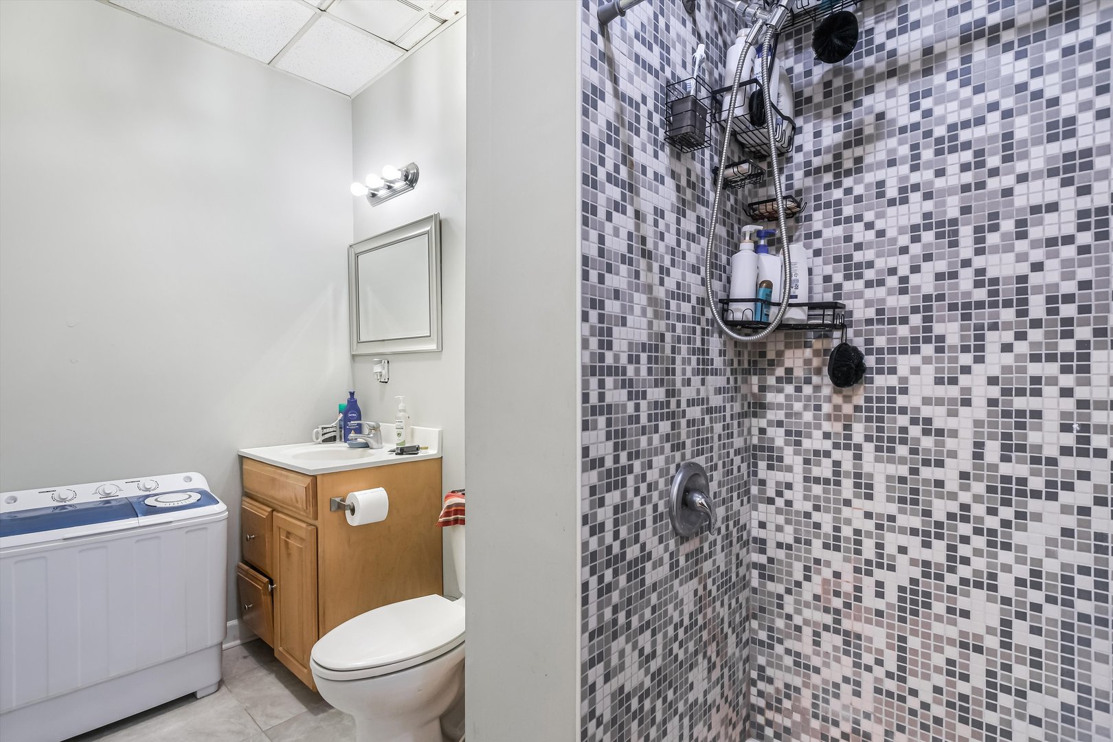 5481 North Northwest Highway Chicago, IL 60630 - Photo 32 of 60 a bathroom with a toilet and a shower curtain