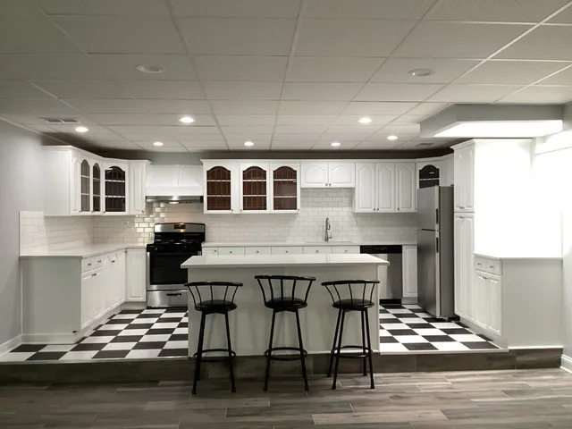 a view of a room with wooden floor