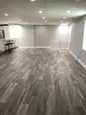 an empty room with closet and a bathroom