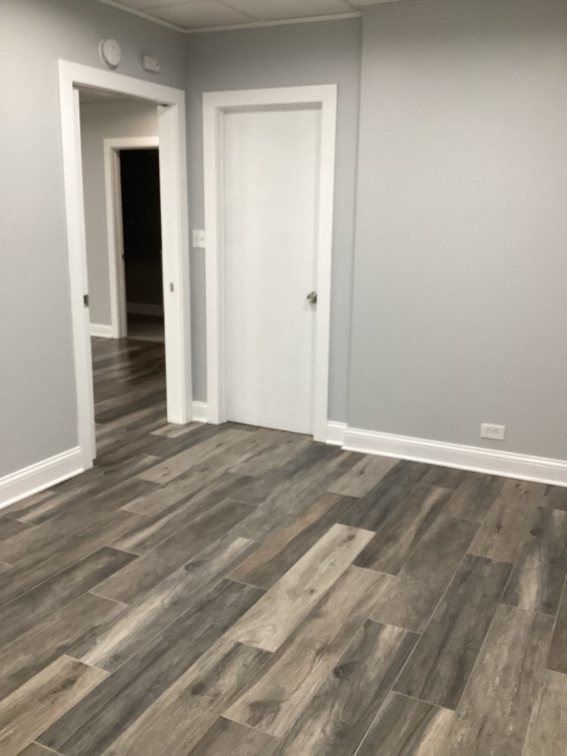 5481 North Northwest Highway Chicago, IL 60630 - Photo 39 of 60 a view of a room with wooden floor