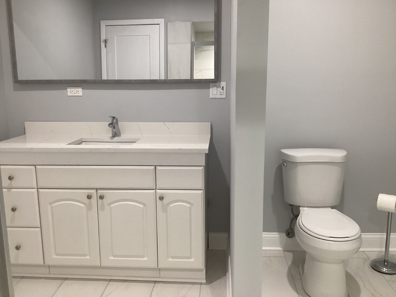 5481 North Northwest Highway Chicago, IL 60630 - Photo 45 of 60 a bathroom with a sink a toilet and mirror