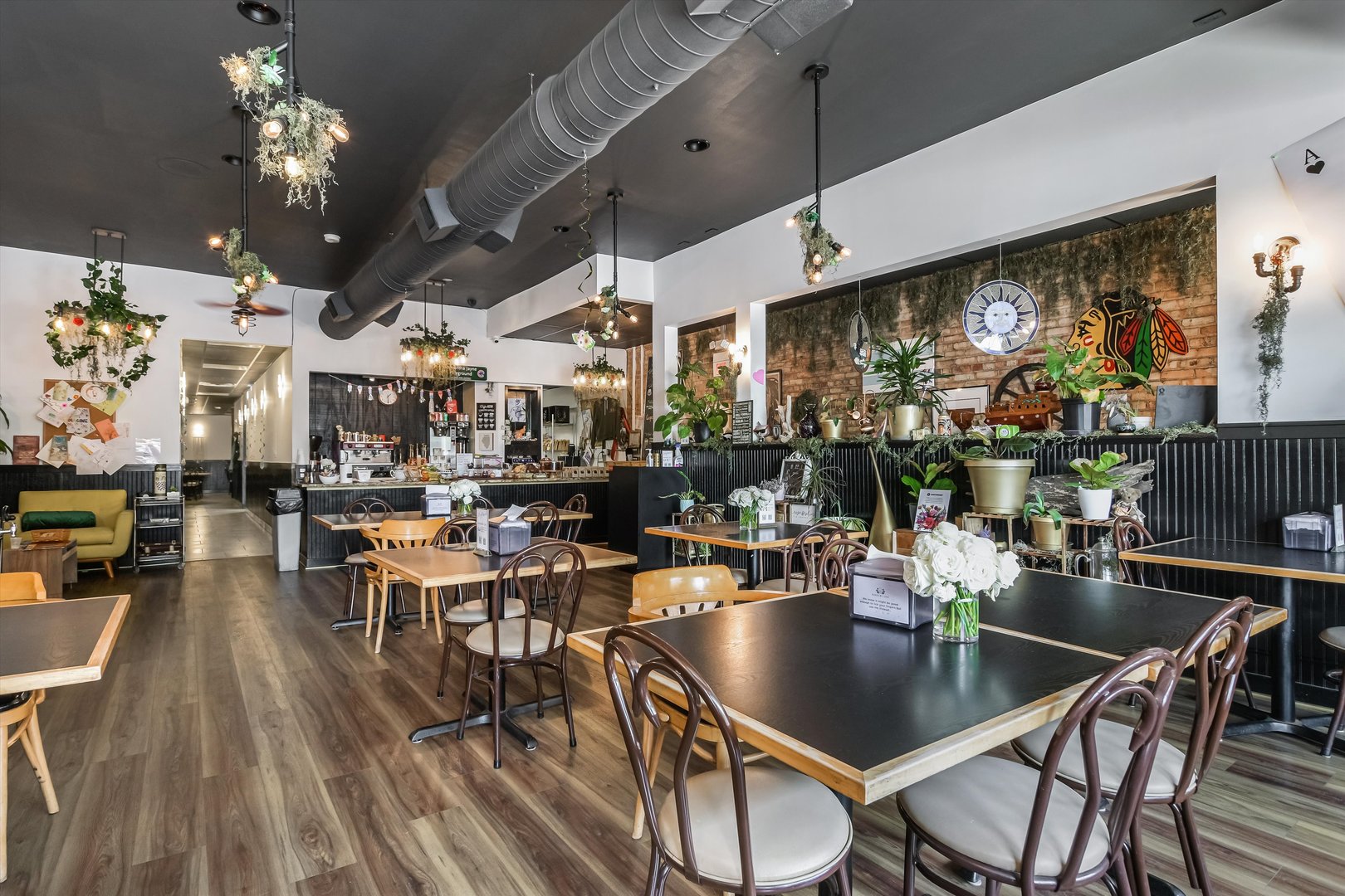 5481 North Northwest Highway Chicago, IL 60630 - Photo 9 of 60 a view of a dining room with furniture window and wooden floor