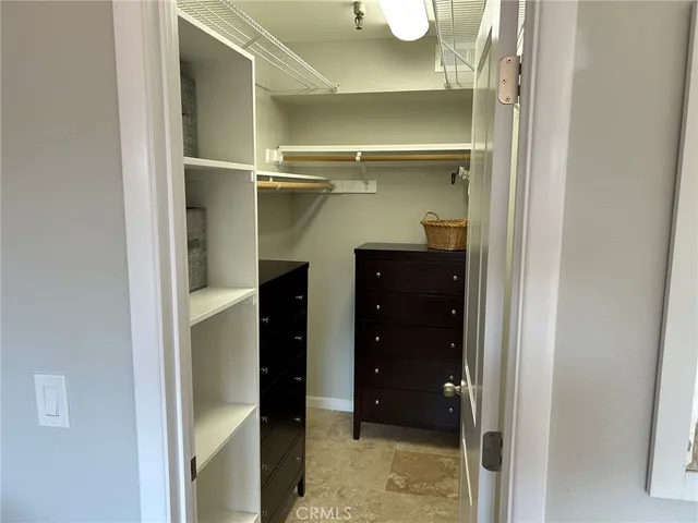 a bathroom with a glass shower door and a sink