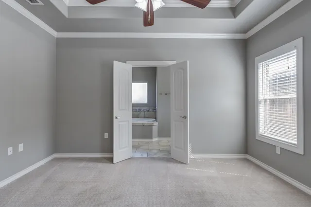 an empty room that has a mirror