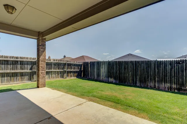 a view of a backyard with a garden