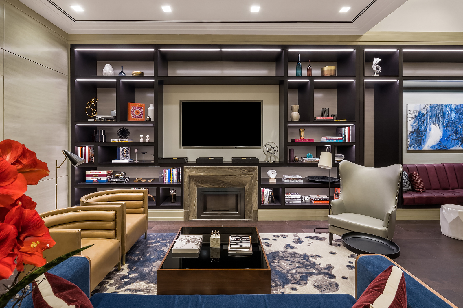 200 East 95th Street, Unit 18A Manhattan, NY 10128 - Photo 18 of 21 a living room with furniture a flat screen tv and a fireplace