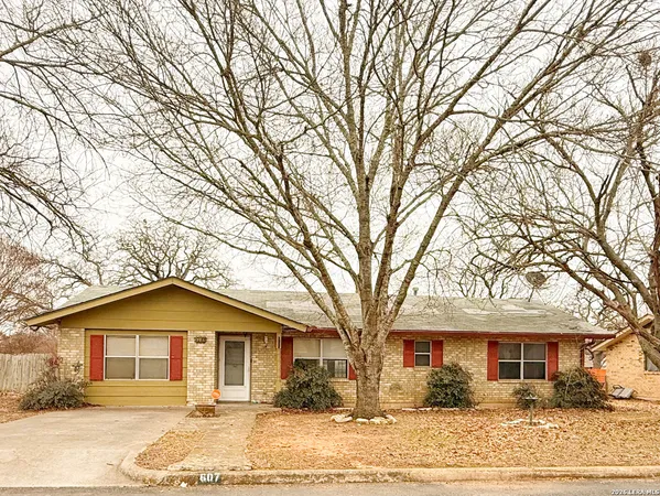 front view of a house with a trees