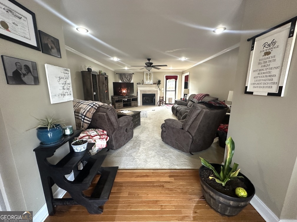 101 Cords Bridge Road Northeast Milledgeville, GA 31061 - Photo 11 of 44 a living room with furniture and wooden floor