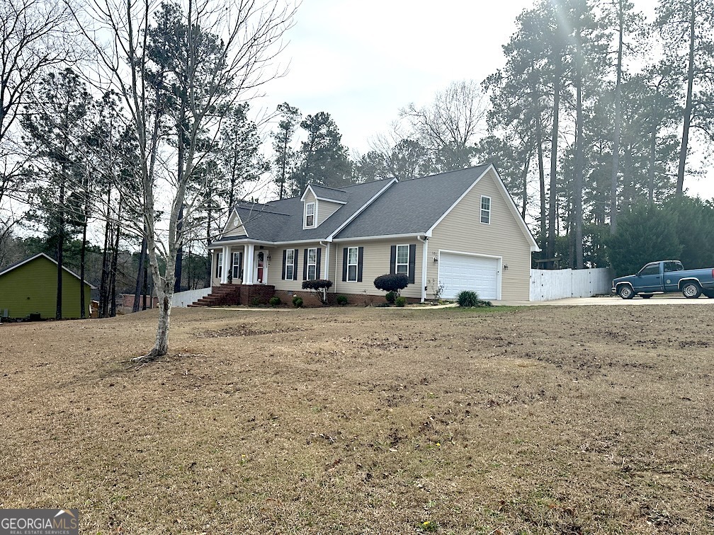 101 Cords Bridge Road Northeast Milledgeville, GA 31061 - Photo 12 of 44 a view of a yard with a house and trees
