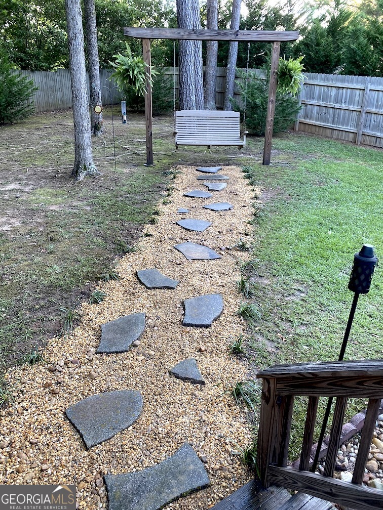 101 Cords Bridge Road Northeast Milledgeville, GA 31061 - Photo 15 of 44 a backyard of a house with seating space