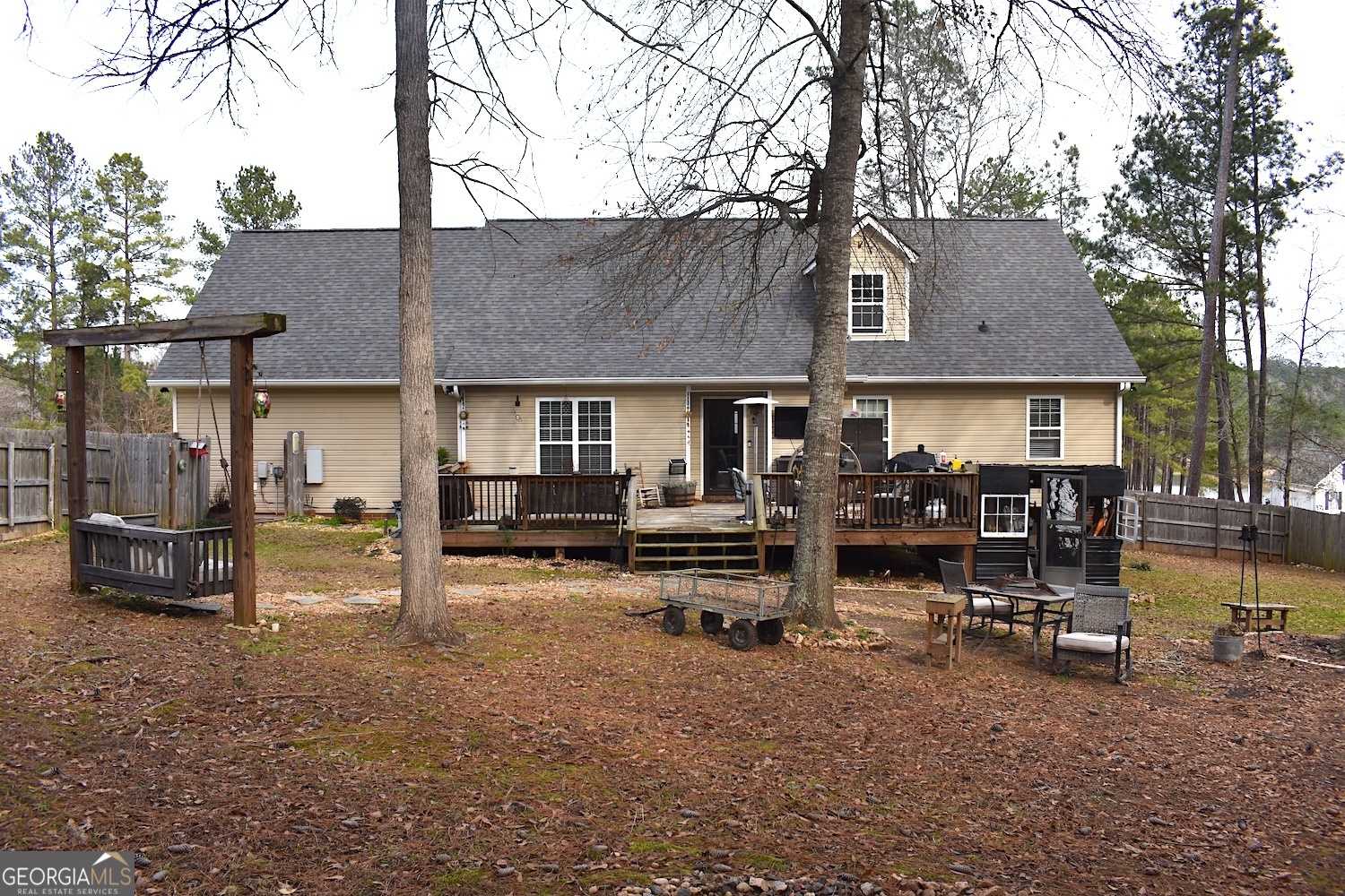 101 Cords Bridge Road Northeast Milledgeville, GA 31061 - Photo 16 of 44 a view of a chairs and table in backyard of the house