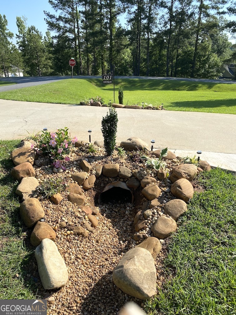 101 Cords Bridge Road Northeast Milledgeville, GA 31061 - Photo 20 of 44 a view of a yard with an outdoor space