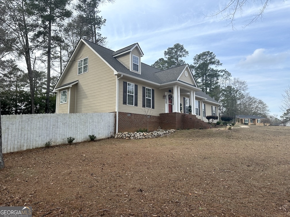 101 Cords Bridge Road Northeast Milledgeville, GA 31061 - Photo 22 of 44 a view of a house with a yard