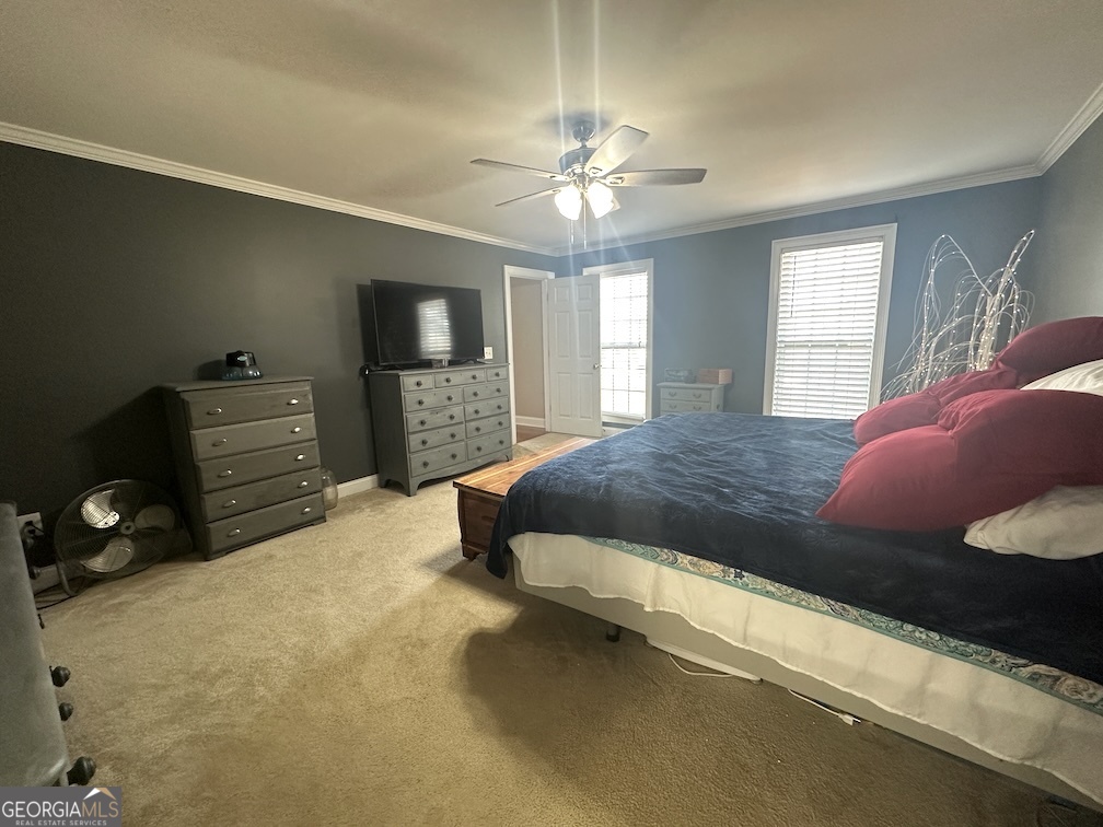 101 Cords Bridge Road Northeast Milledgeville, GA 31061 - Photo 27 of 44 a bedroom with a bed and a tv