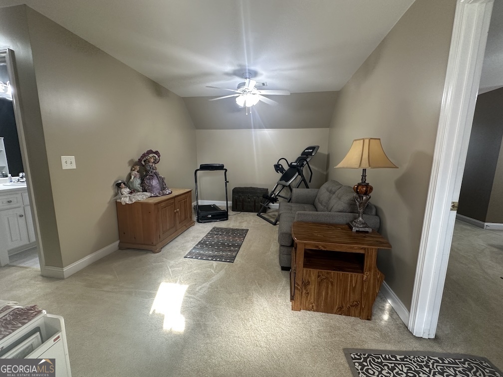101 Cords Bridge Road Northeast Milledgeville, GA 31061 - Photo 31 of 44 a living room with furniture a chandelier