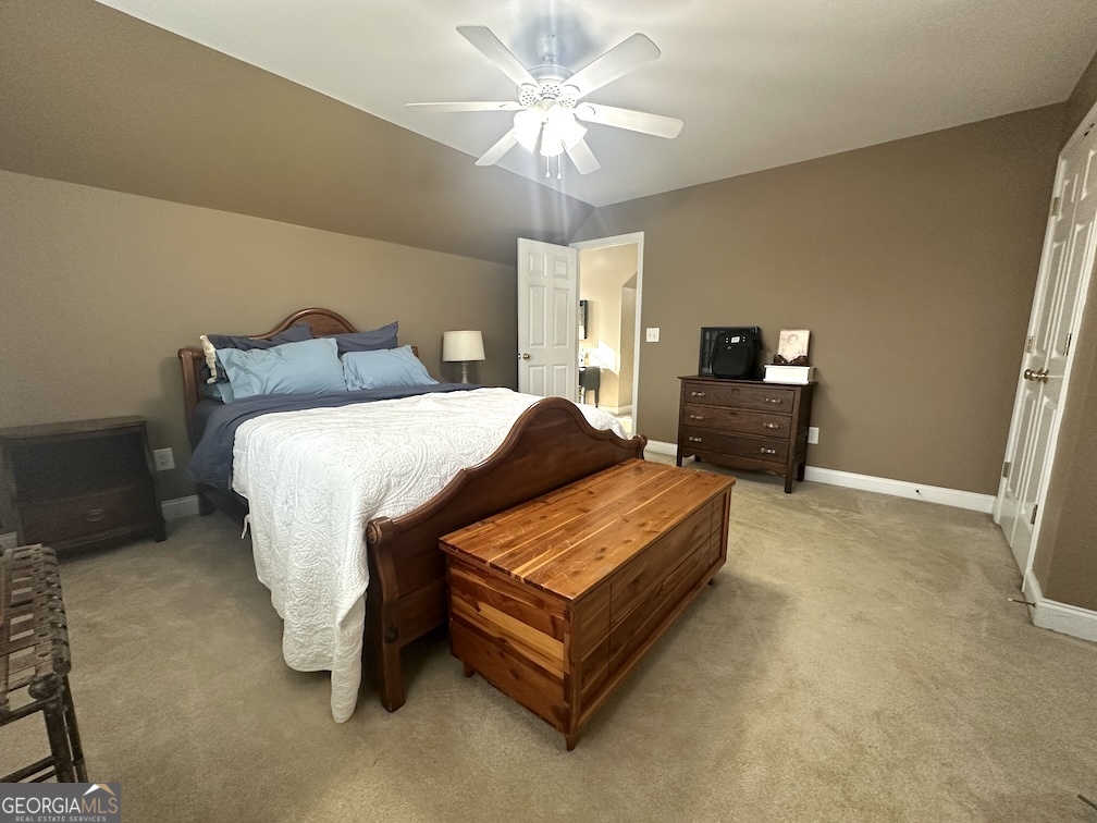 101 Cords Bridge Road Northeast Milledgeville, GA 31061 - Photo 32 of 44 a bedroom with a bed dresser and a window