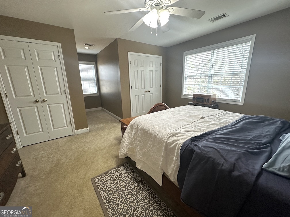 101 Cords Bridge Road Northeast Milledgeville, GA 31061 - Photo 33 of 44 a spacious bedroom with a bed and a window