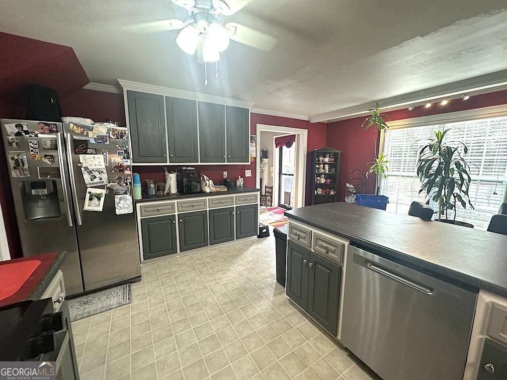 101 Cords Bridge Road Northeast Milledgeville, GA 31061 - Photo 7 of 44 a kitchen with stainless steel appliances a sink and a refrigerator