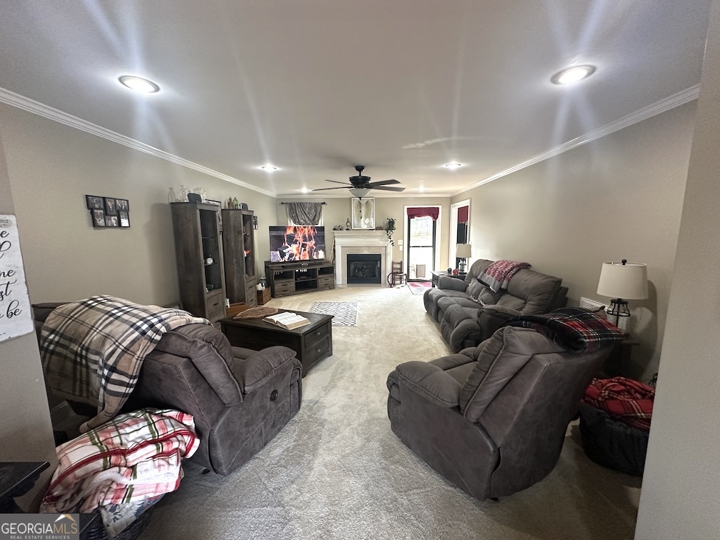 101 Cords Bridge Road Northeast Milledgeville, GA 31061 - Photo 8 of 44 a living room with furniture and a ceiling fan