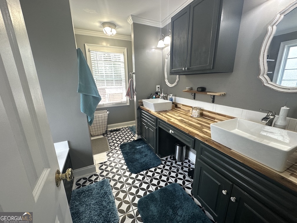 101 Cords Bridge Road Northeast Milledgeville, GA 31061 - Photo 9 of 44 a kitchen with a sink a stove and a window