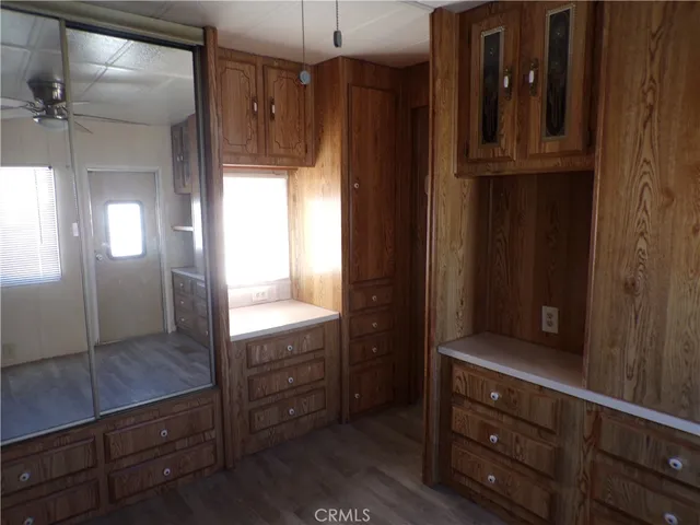 a view of cabinets and mirror