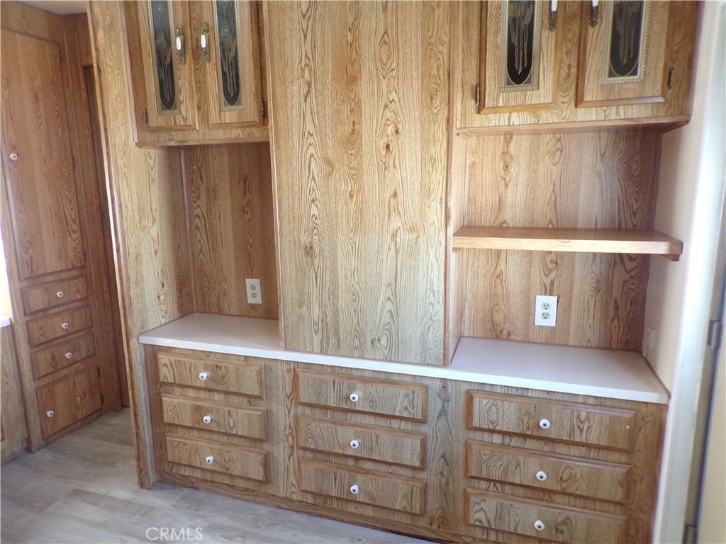 12710 3rd Street, Unit 10 Yucaipa, CA 92399 - Photo 9 of 9 a view of cabinets and mirror