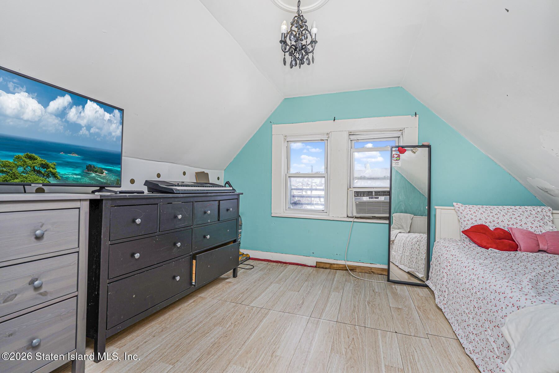 39 Post Lane Staten Island, NY 10303 - Photo 11 of 17 a bedroom with a bed and a window