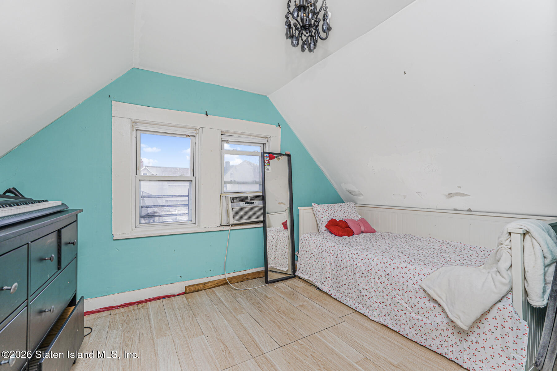 39 Post Lane Staten Island, NY 10303 - Photo 12 of 17 a bedroom with a bed and a window