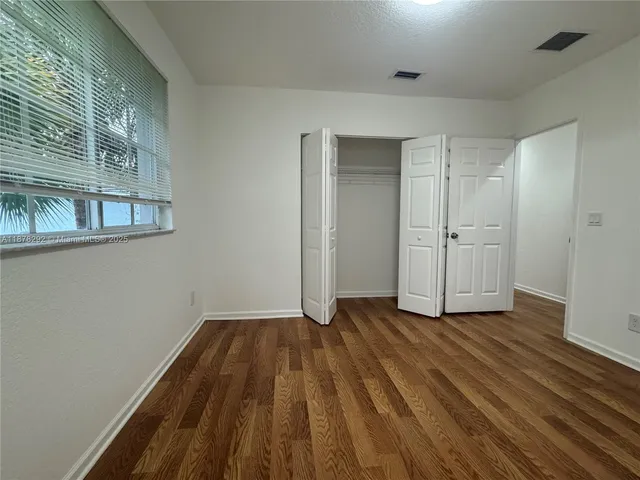 a view of wooden floor in an empty room
