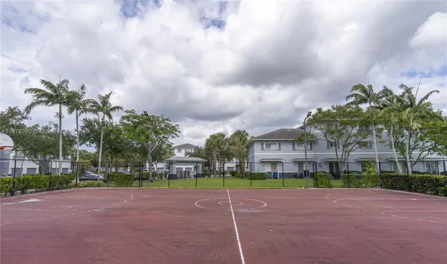 a view of a street with a building in the background