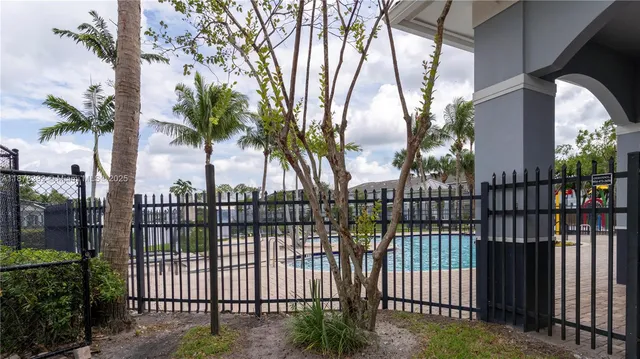 a view of a wrought iron fences in front of house