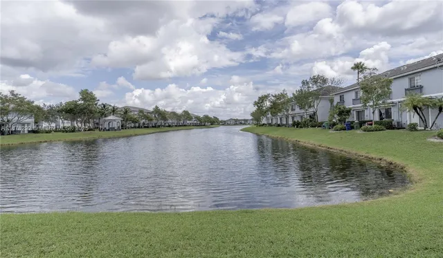 a view of a lake with a big yard