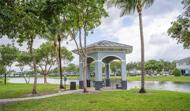 a large white building with a big yard