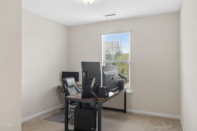 a view of a workspace with furniture