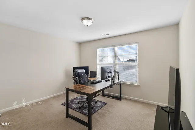 a workspace with furniture and a window