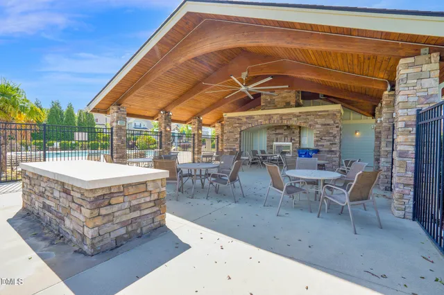 a view of a swimming pool with outdoor seating