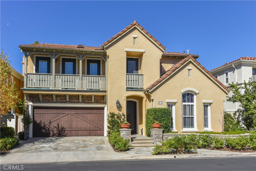 21 Marisol Newport Coast, CA 92657 - Photo 2 of 35 a front view of a house with a yard