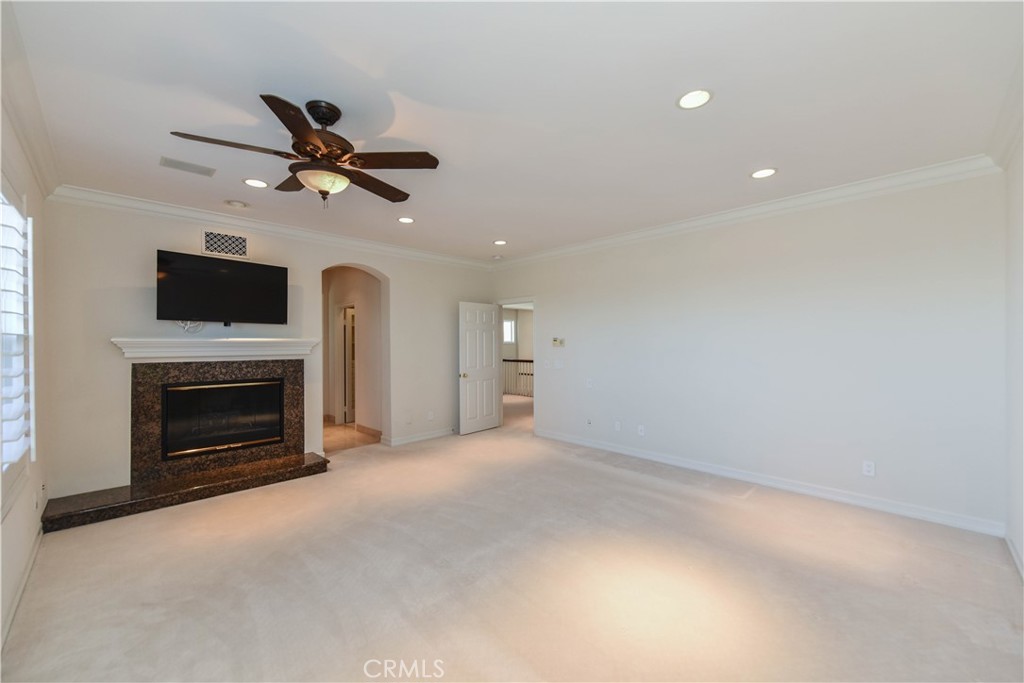 21 Marisol Newport Coast, CA 92657 - Photo 26 of 35 a view of empty room with fireplace and fan