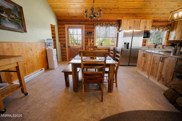 a view of a dining room with furniture window and outside view