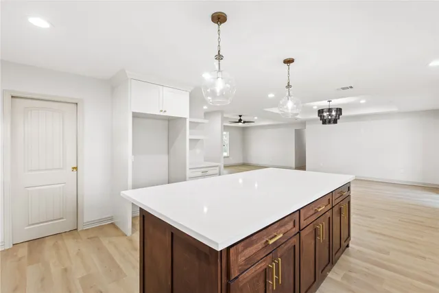 a kitchen that has a cabinets a sink and a stove