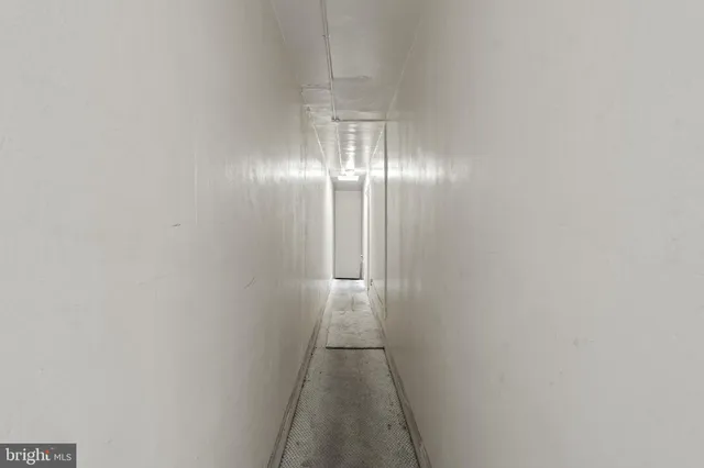 a bathroom with a sink mirror and toilet