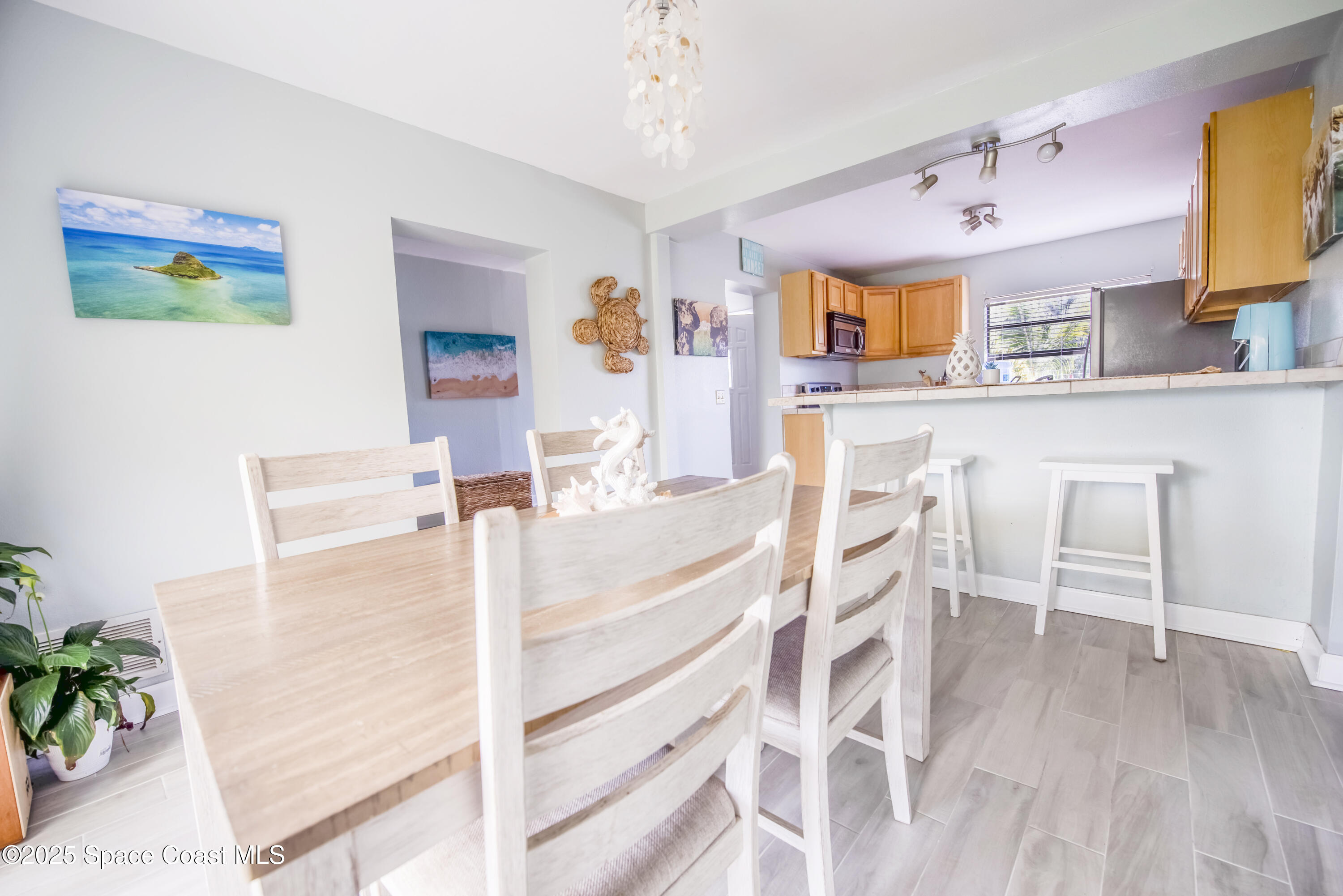 142 Atlantic Avenue Indialantic, FL 32903 - Photo 14 of 27 a view of kitchen with furniture and wooden floor