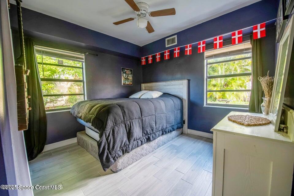 142 Atlantic Avenue Indialantic, FL 32903 - Photo 22 of 27 a bedroom with a bed and a window