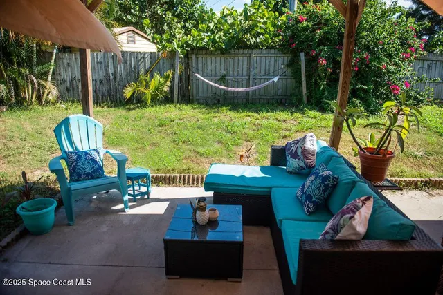 a view of yard with patio