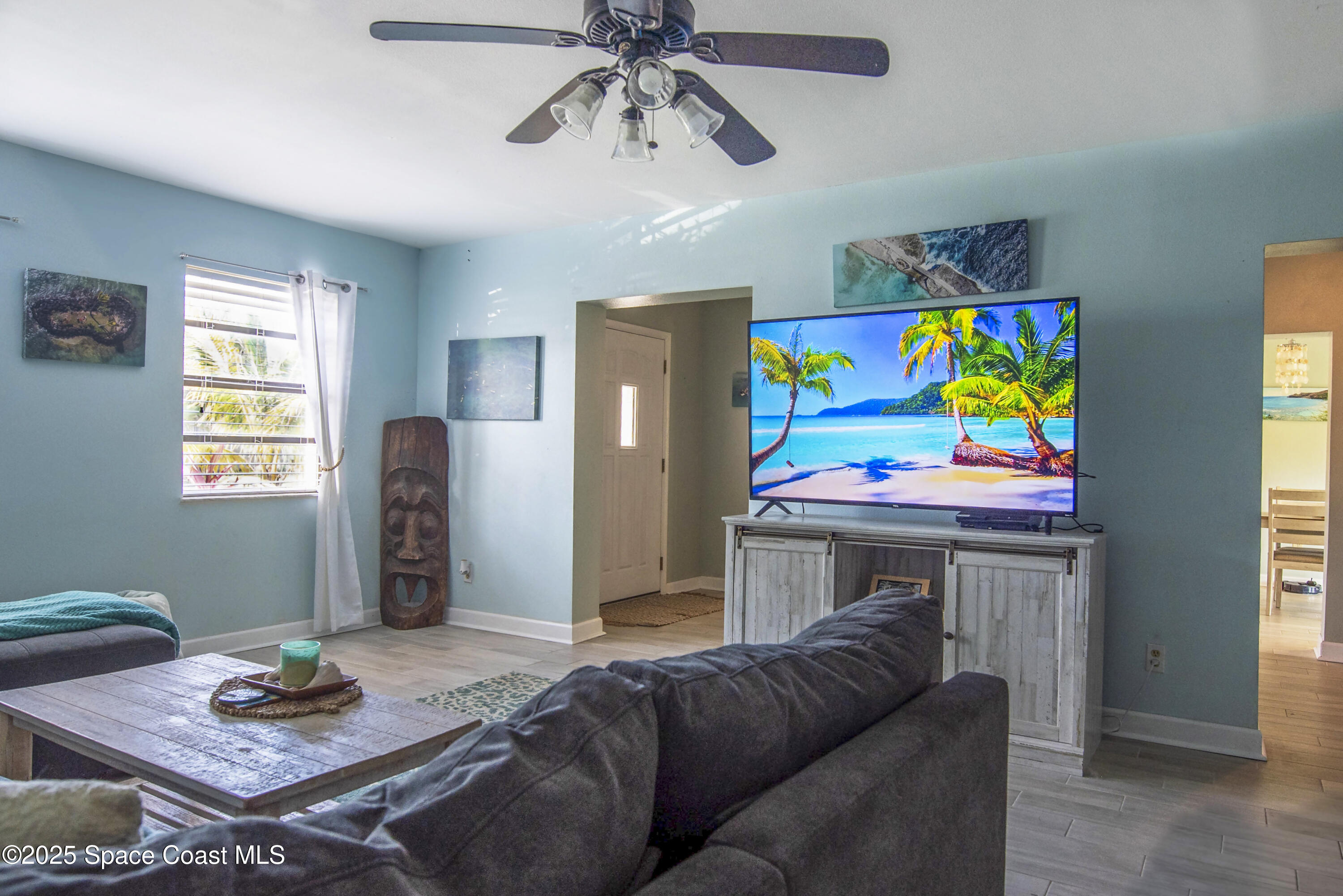 142 Atlantic Avenue Indialantic, FL 32903 - Photo 8 of 27 a living room with furniture and a dining table