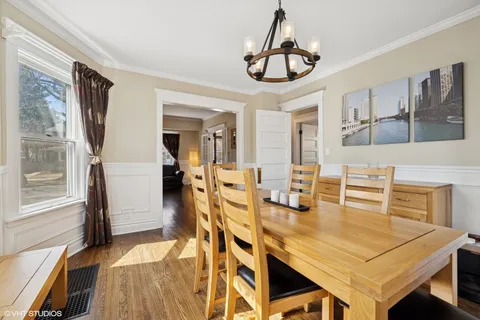 a view of a dining room with furniture and wooden floor